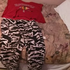 Blackhawks shirt and black, white jeans